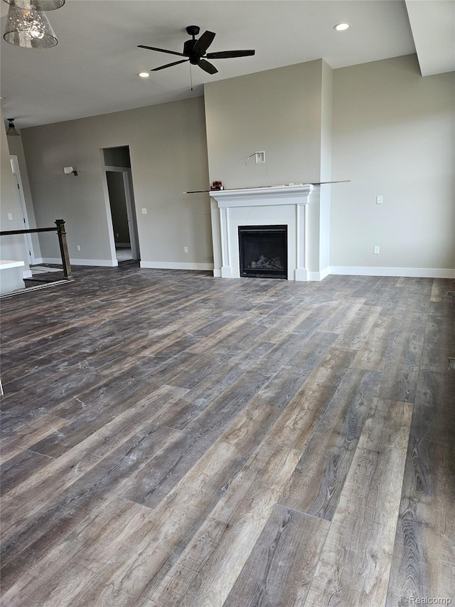 3059 Regatta Dr, St, MI 48079 - unfurnished living room featuring ceiling fan, wood finished floors, a fireplace, recessed lighting, and baseboards