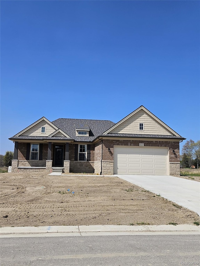 3059 Regatta Dr, St, MI 48079 - view of front of property with concrete driveway, a garage, stone siding, and brick siding