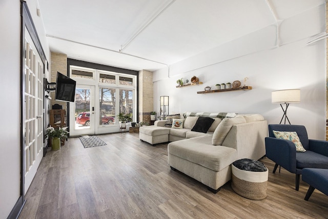 600 Broadway Ave NW Unit 117, Grand Rapids, MI 49504 - living room with french doors and wood finished floors
