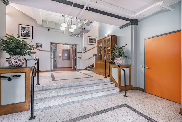 600 Broadway Ave NW Unit 117, Grand Rapids, MI 49504 - foyer entrance featuring baseboards, a towering ceiling, and stairway