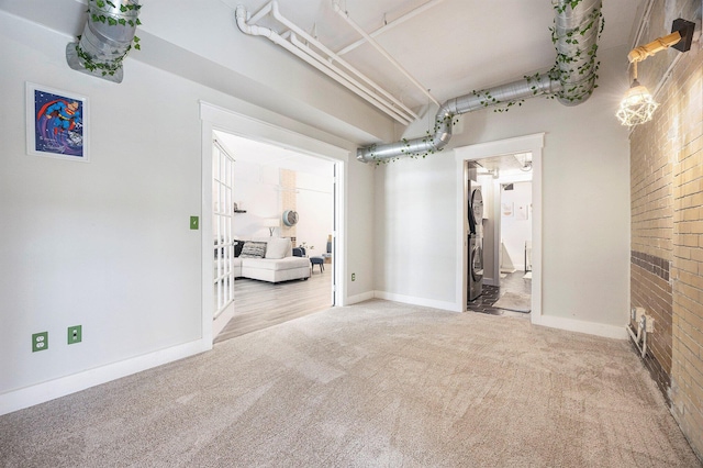 600 Broadway Ave NW Unit 117, Grand Rapids, MI 49504 - basement featuring carpet and baseboards