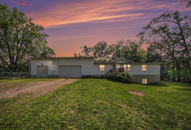149 Hall St, Michigan Center, MI 49254 - view of front facade with driveway and a front lawn