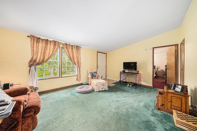149 Hall St, Michigan Center, MI 49254 - living area with carpet flooring, lofted ceiling, and baseboards