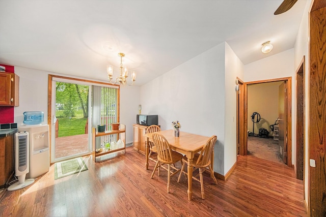 149 Hall St, Michigan Center, MI 49254 - dining room featuring wood finished floors, a chandelier, and baseboards