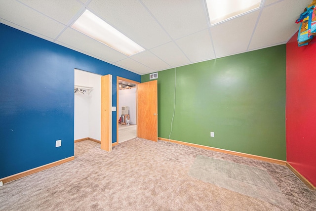 149 Hall St, Michigan Center, MI 49254 - unfurnished bedroom with a drop ceiling, carpet flooring, and baseboards