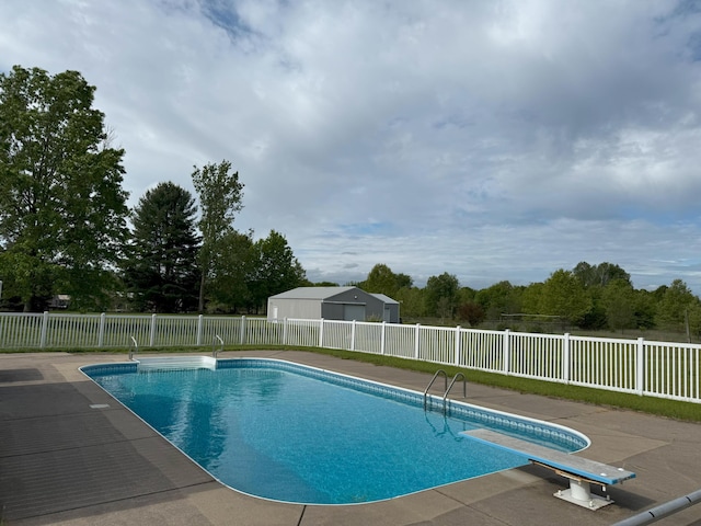 13401 8 1/2 Mile Rd, Battle Creek, MI 49014 - view of pool with a diving board and a patio area