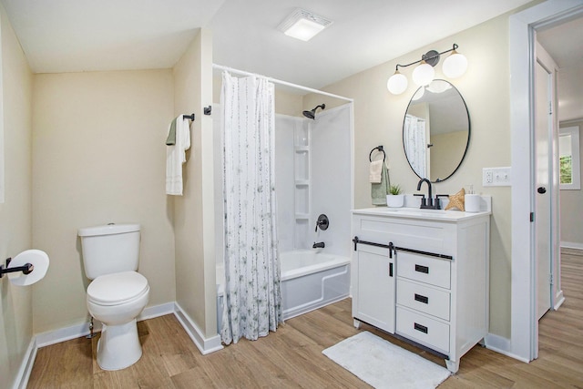 320 Calhoun St, Union City, MI 49094 - full bathroom featuring wood finished floors, vanity, shower / bathtub combination with curtain, and toilet