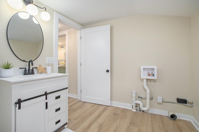 320 Calhoun St, Union City, MI 49094 - washroom with light wood-style flooring, hookup for a washing machine, and baseboards