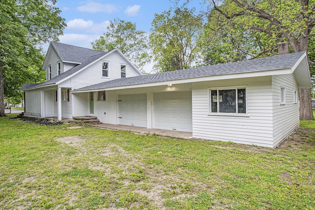 320 Calhoun St, Union City, MI 49094 - view of front of house with roof with shingles, a garage, a front yard, and a chimney