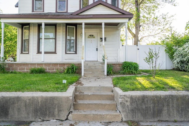 1007 Ionia Ave SW, Grand Rapids, MI 49507 - view of front of home with a porch and a gate