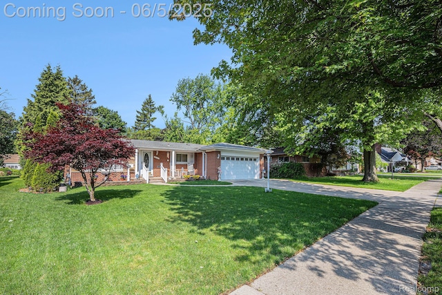 15025 Kipke, Redford, MI 48239 - view of front of property with driveway, a front yard, brick siding, and a garage