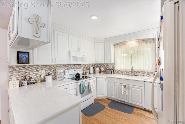 15025 Kipke, Redford, MI 48239 - kitchen with white appliances, a sink, a peninsula, white cabinetry, and recessed lighting