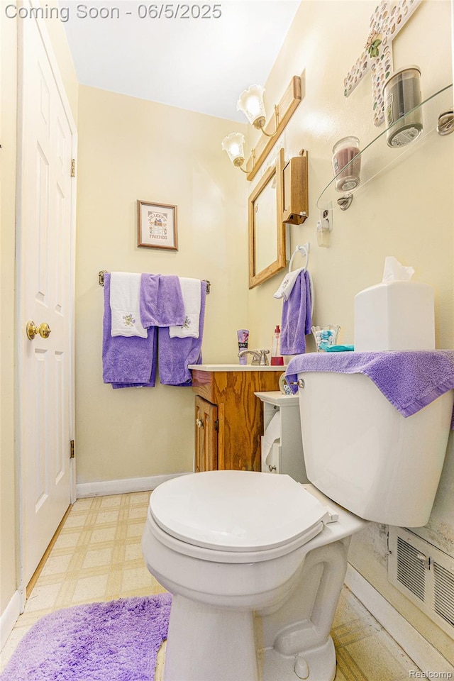 15025 Kipke, Redford, MI 48239 - half bathroom with vanity, tile patterned floors, toilet, and baseboards