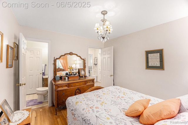15025 Kipke, Redford, MI 48239 - bedroom with a chandelier, light wood-style floors, and connected bathroom