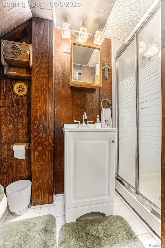 15025 Kipke, Redford, MI 48239 - full bath with wooden walls, a shower stall, toilet, vanity, and tile patterned floors