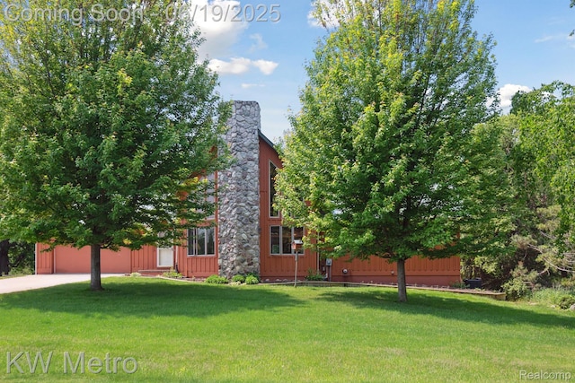 4333 Running Deer Trl, Pigeon, MI 48755 - view of home's exterior featuring a yard, board and batten siding, and driveway