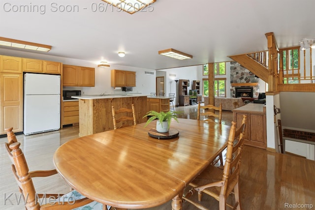 4333 Running Deer Trl, Pigeon, MI 48755 - dining area with a fireplace and light wood finished floors