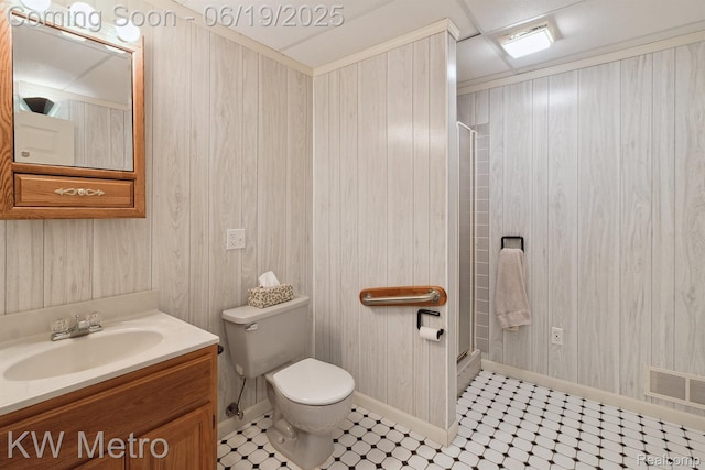 4333 Running Deer Trl, Pigeon, MI 48755 - bathroom featuring a stall shower, vanity, wood walls, and tile patterned floors