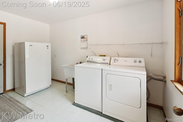 4333 Running Deer Trl, Pigeon, MI 48755 - laundry room with washing machine and clothes dryer and light tile patterned floors