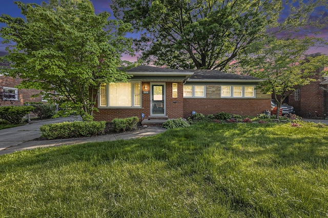 21406 Broadstone St, Harper Woods, MI 48225 - view of front of property featuring a yard and brick siding
