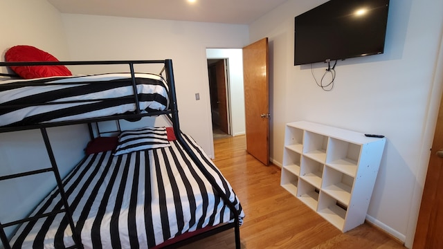 21406 Broadstone St, Harper Woods, MI 48225 - bedroom with light wood-type flooring and baseboards