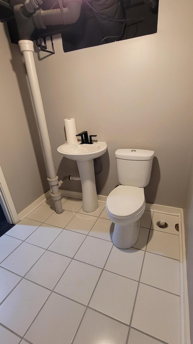 21406 Broadstone St, Harper Woods, MI 48225 - half bathroom featuring toilet, tile patterned floors, and baseboards