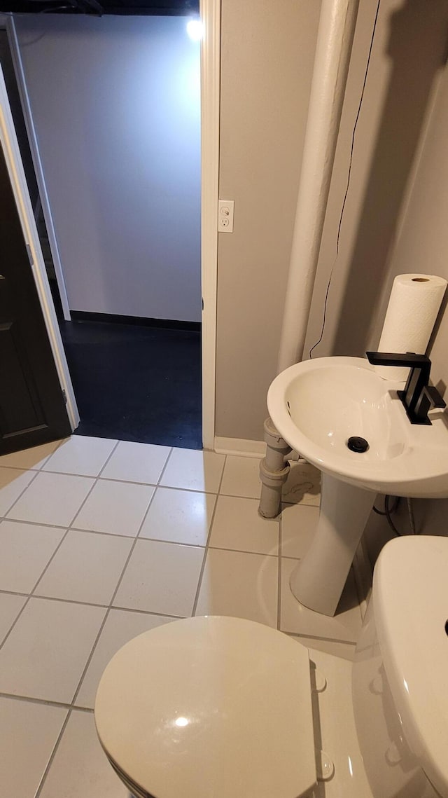21406 Broadstone St, Harper Woods, MI 48225 - bathroom featuring toilet, tile patterned flooring, and baseboards