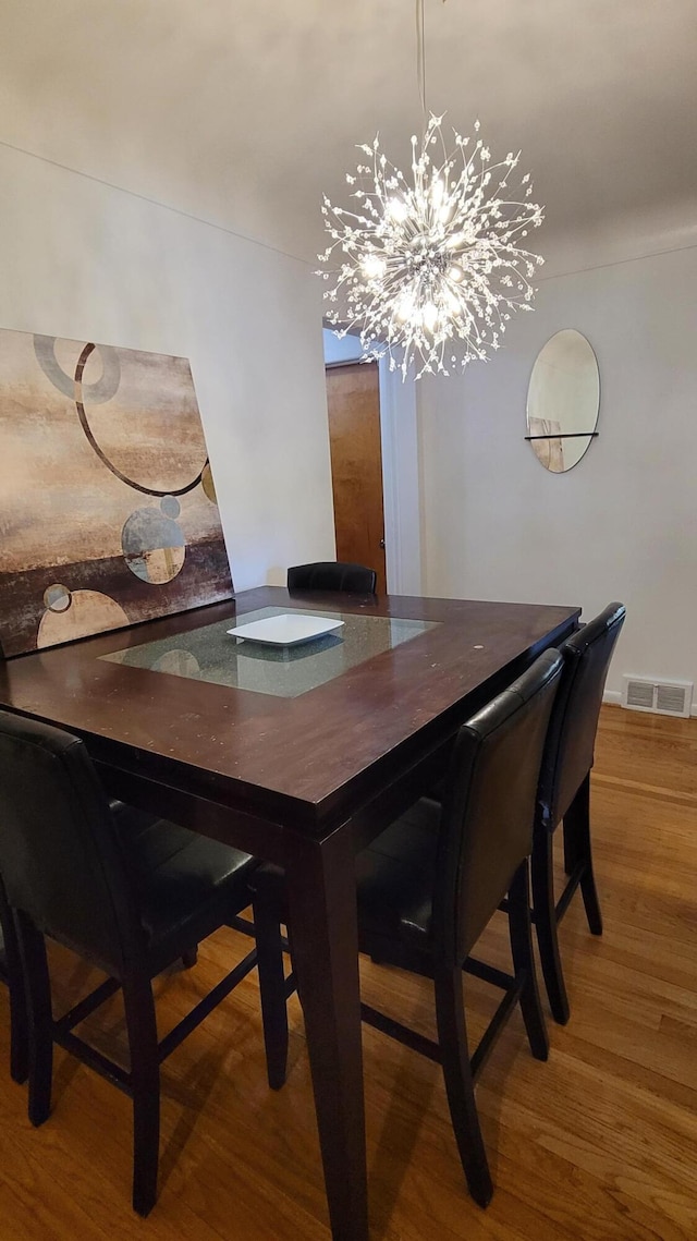 21406 Broadstone St, Harper Woods, MI 48225 - dining space with wood finished floors and a chandelier