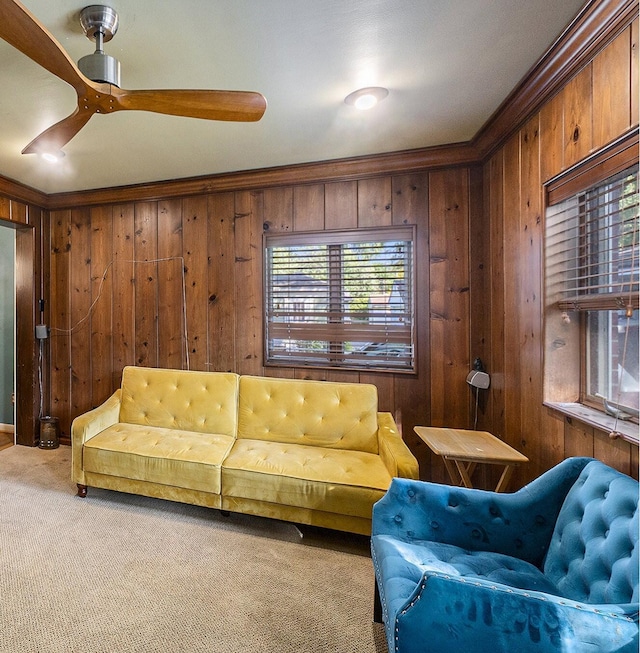 21406 Broadstone St, Harper Woods, MI 48225 - living area with wooden walls, carpet flooring, ceiling fan, and ornamental molding
