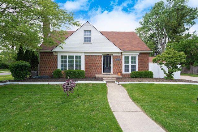 15501 E Jefferson Ave, Grosse Pointe Park, MI 48230 - view of front facade featuring brick siding and central AC