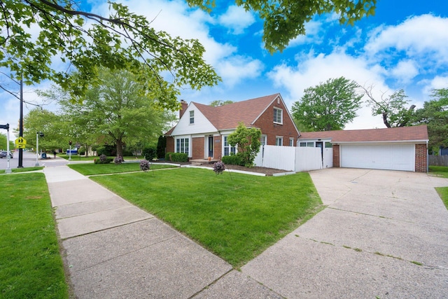 15501 E Jefferson Ave, Grosse Pointe Park, MI 48230 - view of front of house with brick siding, a chimney, a garage, and driveway