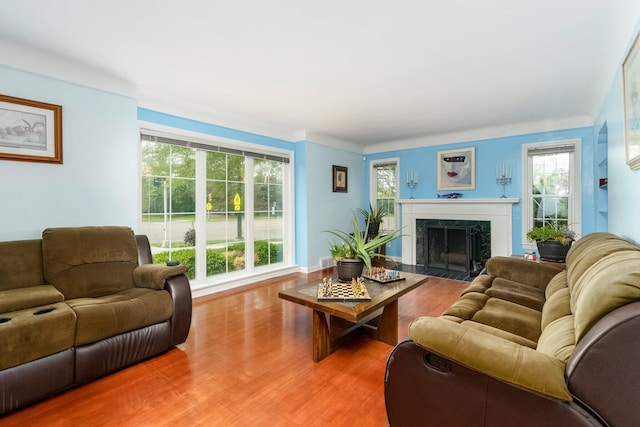 15501 E Jefferson Ave, Grosse Pointe Park, MI 48230 - living room featuring light wood finished floors, a high end fireplace, and healthy amount of natural light