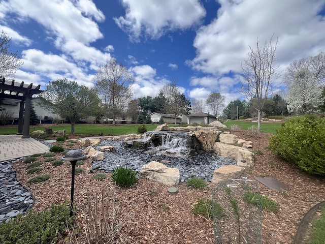 3817 Butterworth St SW, Grand Rapids, MI 49534 - view of yard featuring a pergola and a garden pond