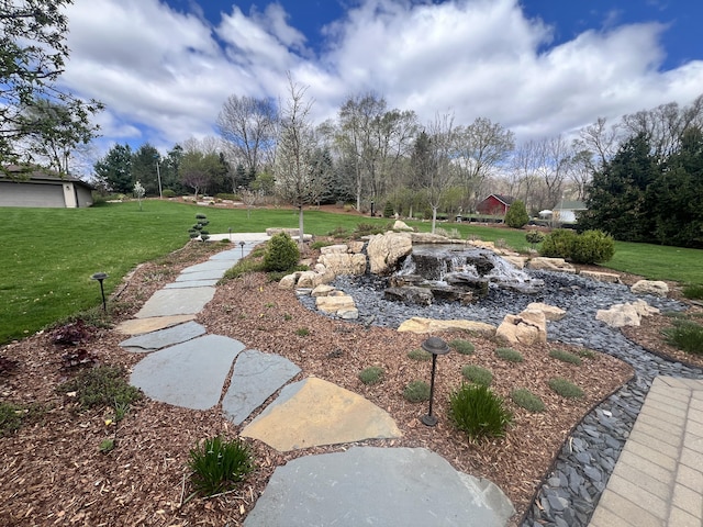 3817 Butterworth St SW, Grand Rapids, MI 49534 - view of green lawn featuring a small pond