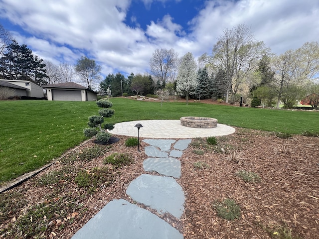 3817 Butterworth St SW, Grand Rapids, MI 49534 - view of grassy yard with an outdoor fire pit