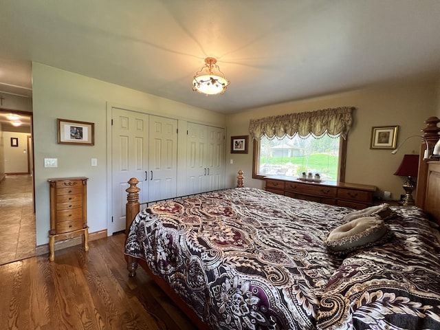 3817 Butterworth St SW, Grand Rapids, MI 49534 - bedroom with dark wood-style floors, a closet, and baseboards