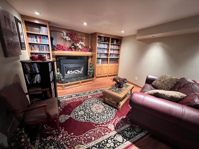 3817 Butterworth St SW, Grand Rapids, MI 49534 - living room with wood finished floors, a tile fireplace, and recessed lighting