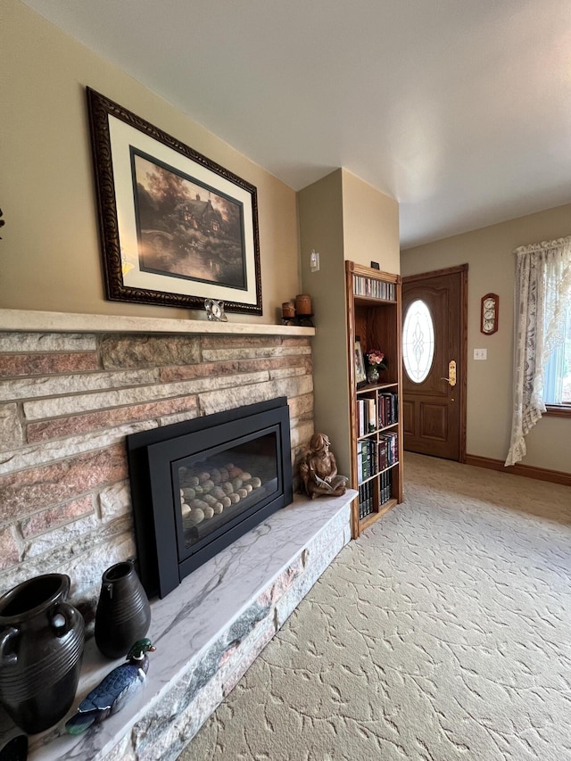 3817 Butterworth St SW, Grand Rapids, MI 49534 - living room with a stone fireplace and baseboards