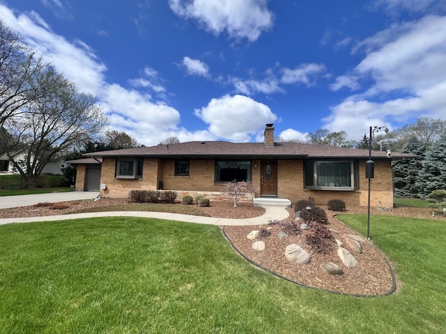3817 Butterworth St SW, Grand Rapids, MI 49534 - ranch-style house featuring a chimney, brick siding, a front yard, an attached garage, and driveway
