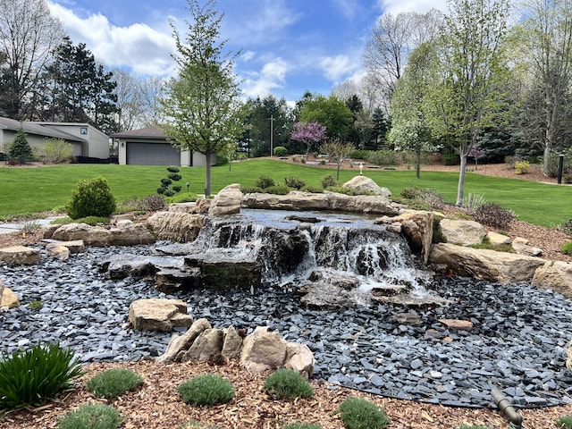 3817 Butterworth St SW, Grand Rapids, MI 49534 - view of green lawn with a small pond