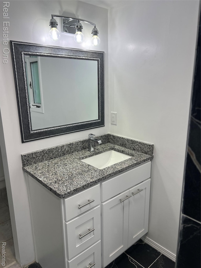 22767 Middlebelt Rd, Farmington Hills, MI 48336 - bathroom with vanity and baseboards