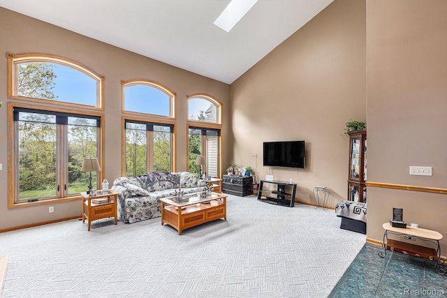 1437 Rillview Ct, Metamora, MI 48455 - living area featuring high vaulted ceiling, baseboards, a skylight, and carpet floors