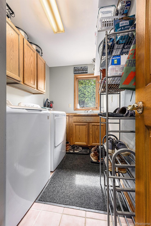 1437 Rillview Ct, Metamora, MI 48455 - washroom featuring washing machine and clothes dryer, cabinet space, and tile patterned flooring