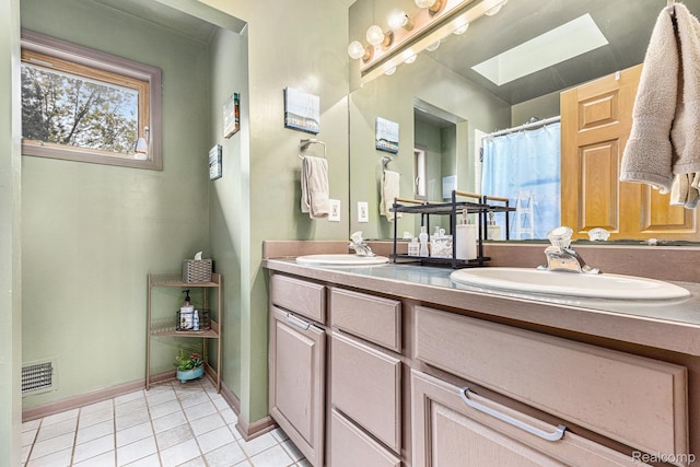 1437 Rillview Ct, Metamora, MI 48455 - full bath featuring double vanity, tile patterned floors, a skylight, and baseboards