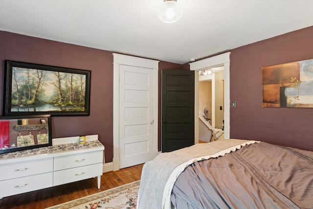 700 S Washington, Mount Pleasant, MI 48858 - bedroom featuring wood finished floors and baseboards