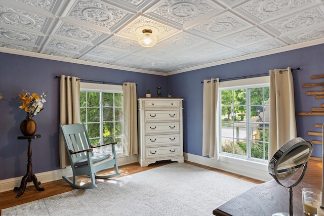 700 S Washington, Mount Pleasant, MI 48858 - sitting room featuring an ornate ceiling, healthy amount of natural light, light wood-style flooring, baseboards, and crown molding