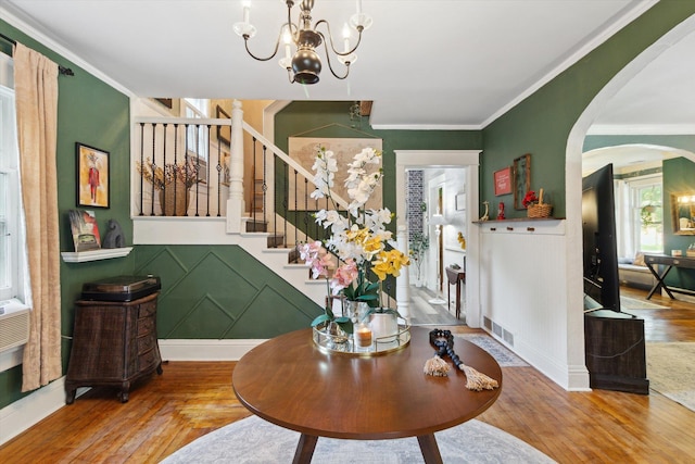 700 S Washington, Mount Pleasant, MI 48858 - foyer entrance with arched walkways, ornamental molding, wood finished floors, stairs, and a decorative wall
