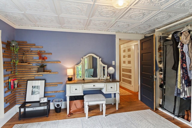 700 S Washington, Mount Pleasant, MI 48858 - bedroom featuring an ornate ceiling, wood finished floors, baseboards, and ornamental molding