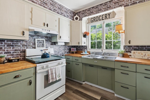 700 S Washington, Mount Pleasant, MI 48858 - kitchen featuring butcher block countertops, green cabinetry, white electric range, and ornamental molding