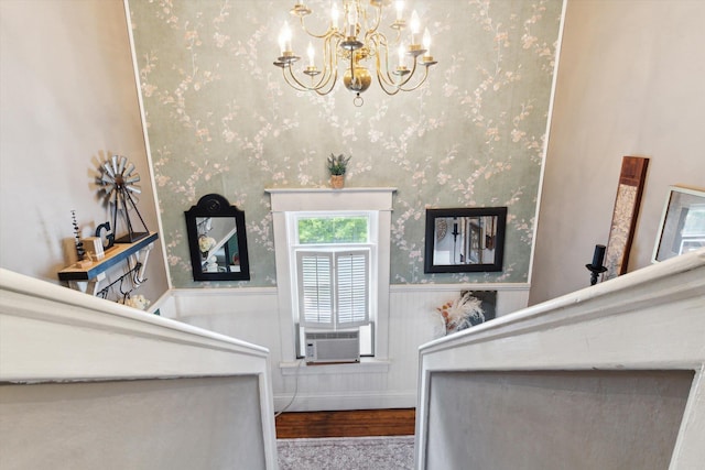 700 S Washington, Mount Pleasant, MI 48858 - staircase featuring wainscoting, a chandelier, cooling unit, wood finished floors, and wallpapered walls
